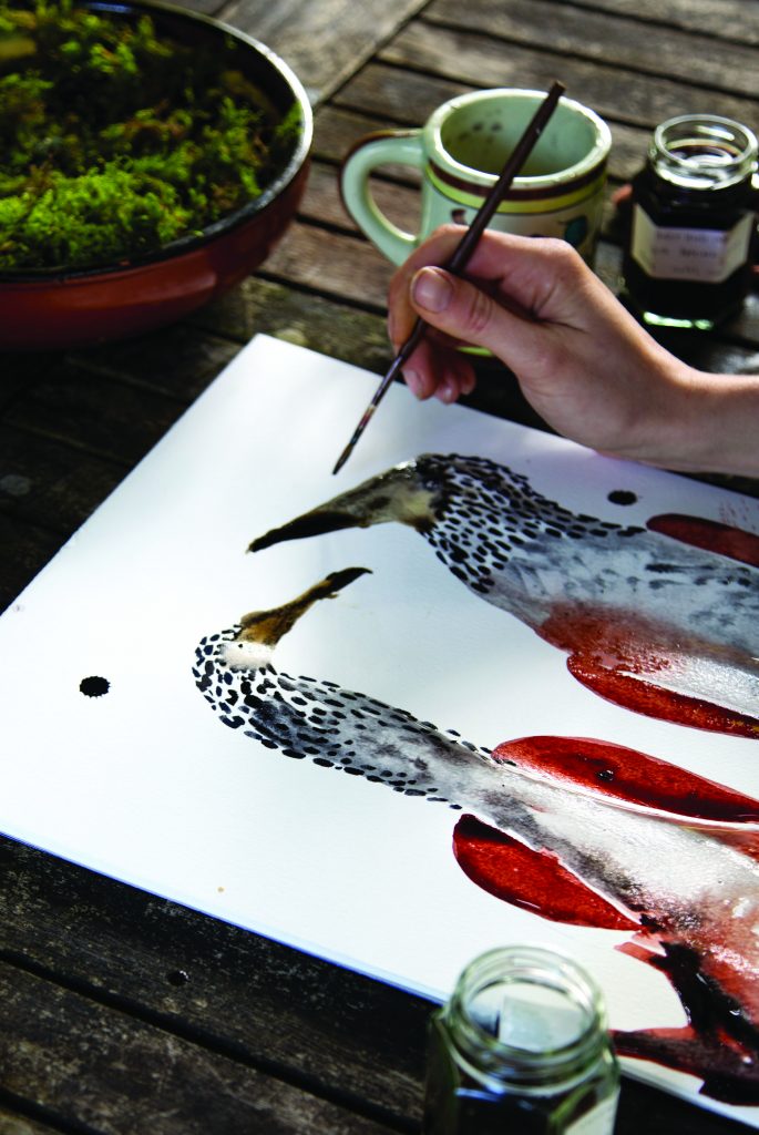 Flora Wallace painting birds with foraged inks