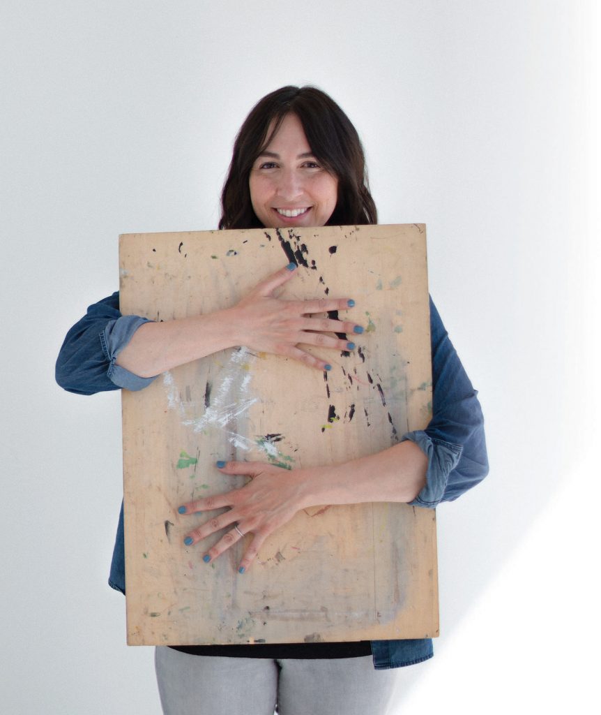 Alia Bright posing with an art board